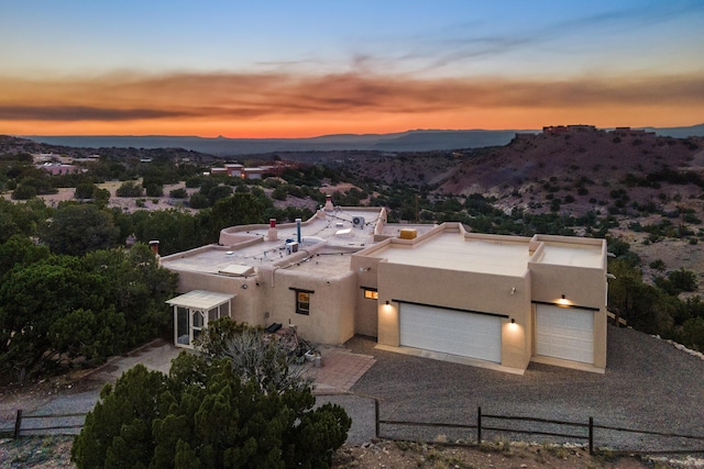 aerial view at dusk with a mountain view