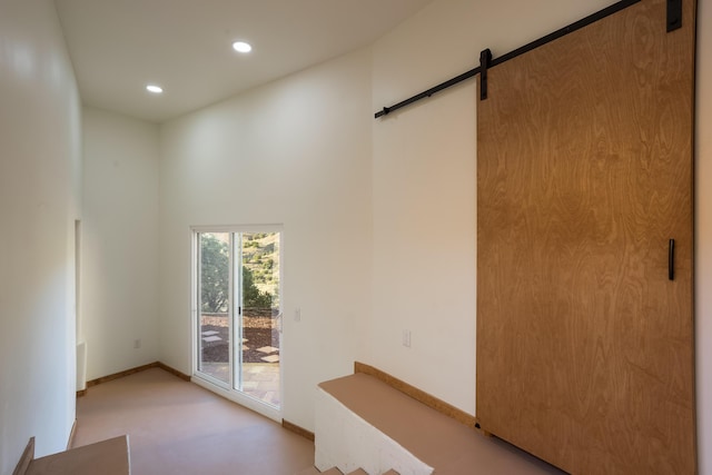 interior space featuring a barn door