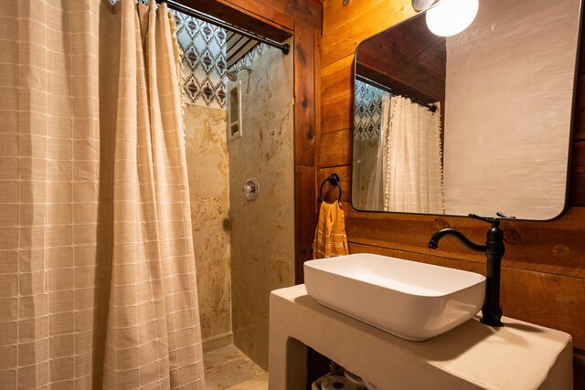 bathroom with sink and a shower with curtain