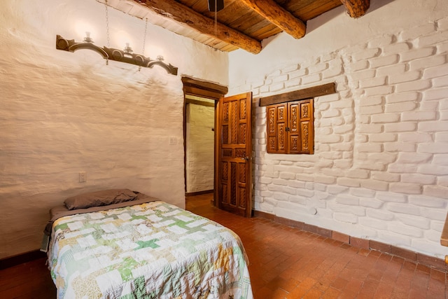 unfurnished bedroom featuring beamed ceiling and wooden ceiling