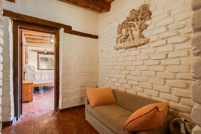 sitting room with beamed ceiling