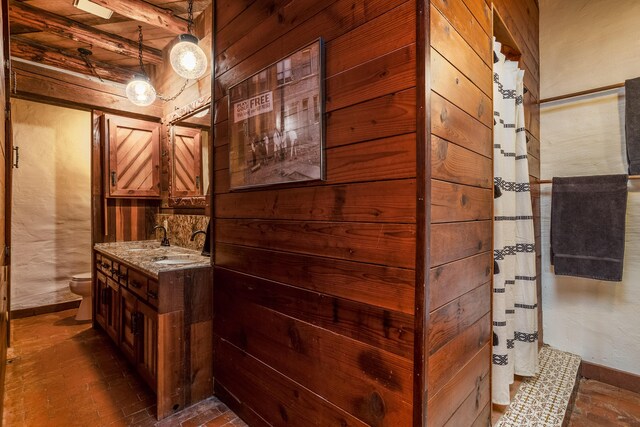 interior space featuring vanity and toilet