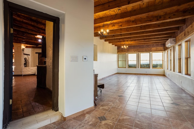 tiled spare room with an AC wall unit, a notable chandelier, beam ceiling, and wood ceiling