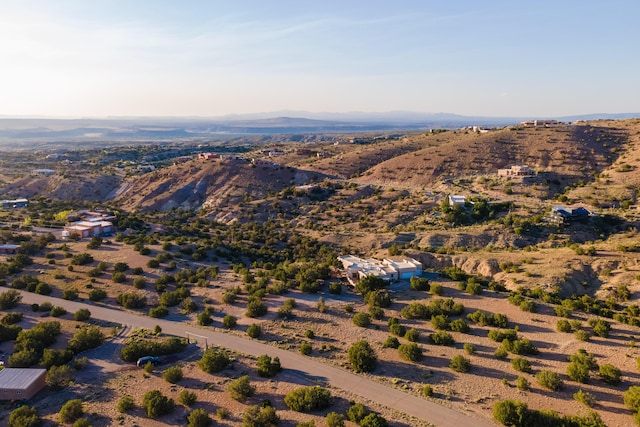 birds eye view of property featuring a mountain view