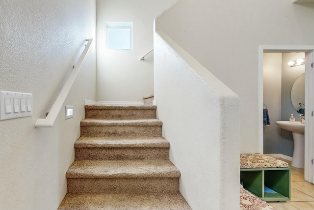 staircase with tile patterned flooring