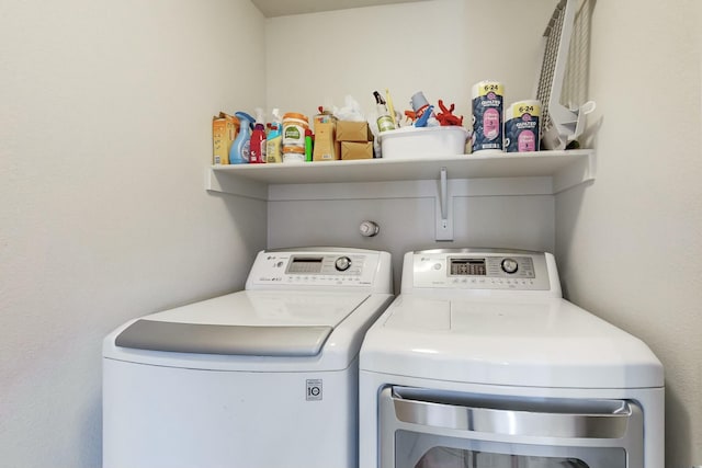 washroom with washing machine and dryer