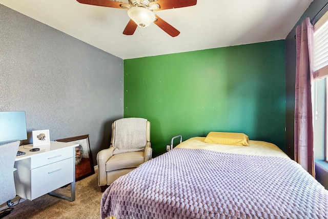 bedroom with light carpet and ceiling fan