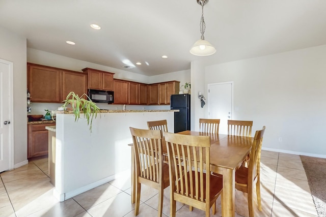 dining space with light tile patterned floors