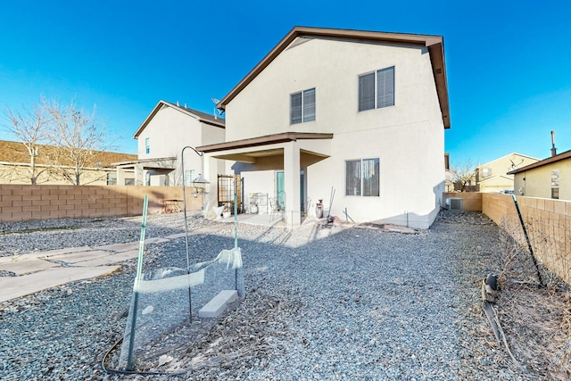 back of house featuring a patio and central air condition unit