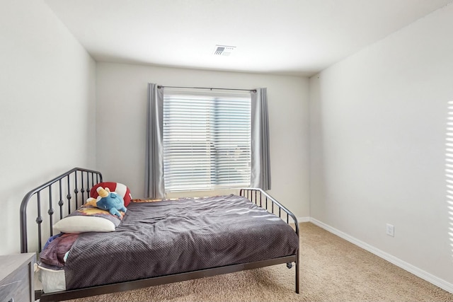 bedroom with light carpet