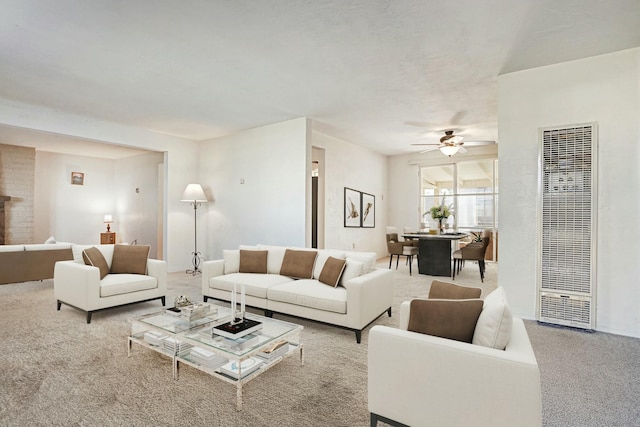 carpeted living room featuring ceiling fan