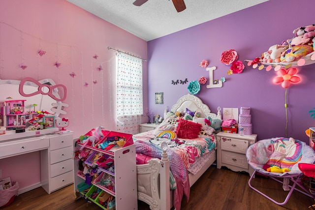 bedroom featuring ceiling fan, dark hardwood / wood-style floors, and a textured ceiling