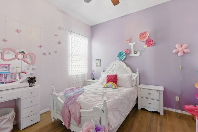 bedroom with wood finished floors, baseboards, and ceiling fan