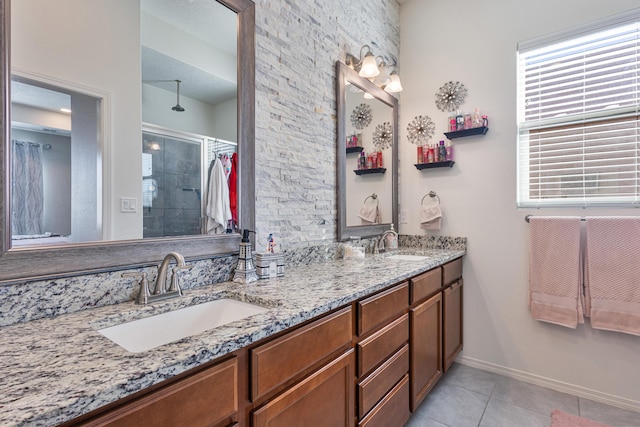 bathroom featuring vanity, tile patterned floors, and walk in shower