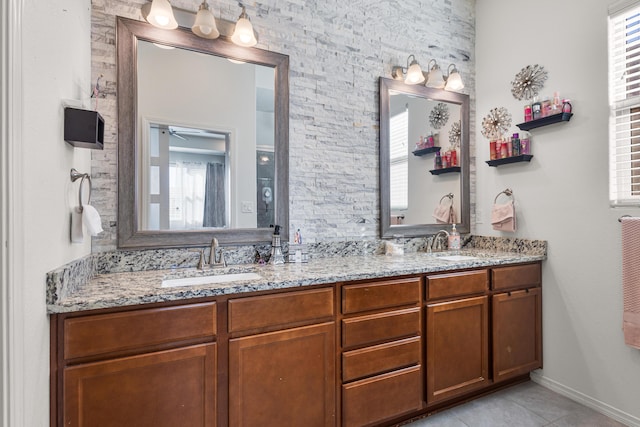 bathroom featuring plenty of natural light, tile patterned flooring, and vanity