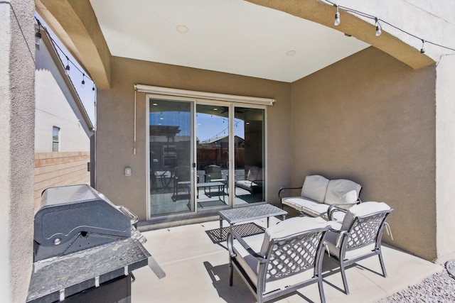 view of patio / terrace featuring area for grilling and fence