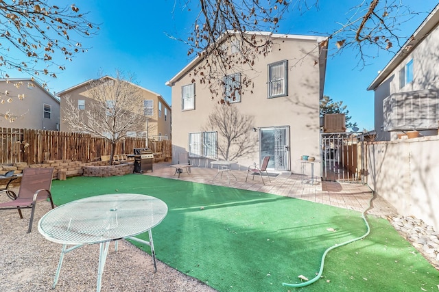 rear view of property featuring a patio