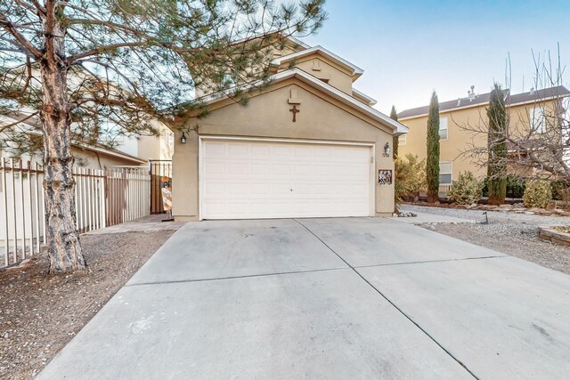 view of front of property featuring a garage and an outdoor structure