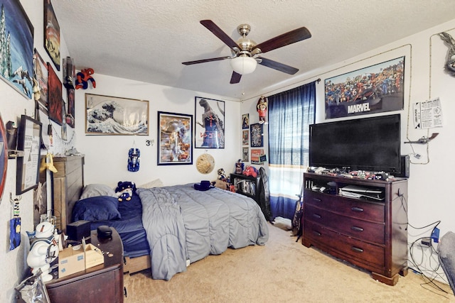 carpeted bedroom featuring ceiling fan and a textured ceiling