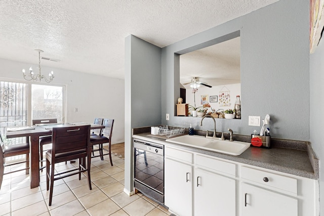 kitchen with ceiling fan with notable chandelier, dishwasher, white cabinetry, sink, and hanging light fixtures