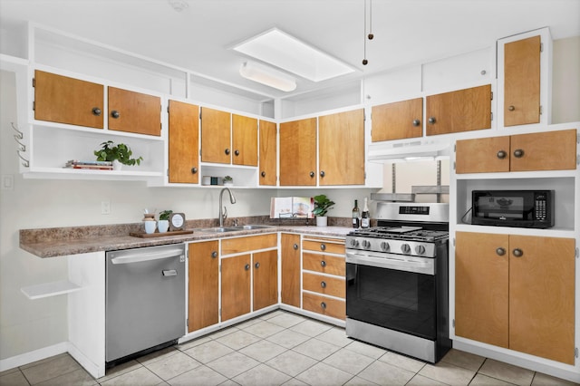 kitchen featuring sink, light tile patterned floors, and appliances with stainless steel finishes