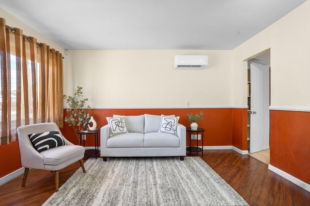 living area featuring hardwood / wood-style flooring and a wall mounted air conditioner