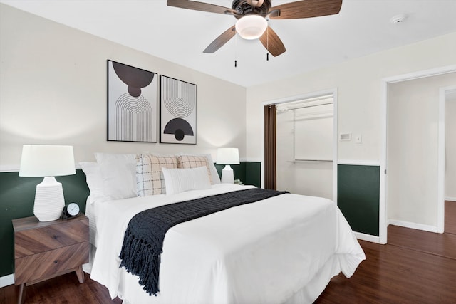 bedroom with ceiling fan, dark hardwood / wood-style flooring, and a closet