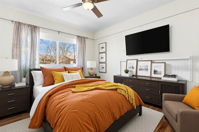 bedroom with wood-type flooring and ceiling fan