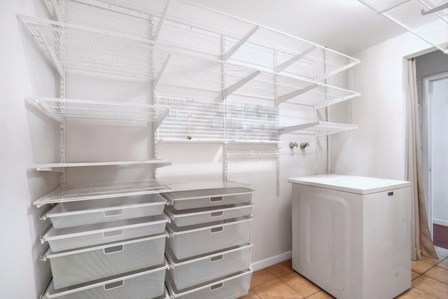 spacious closet with light tile patterned flooring