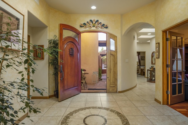 foyer entrance featuring light tile patterned floors