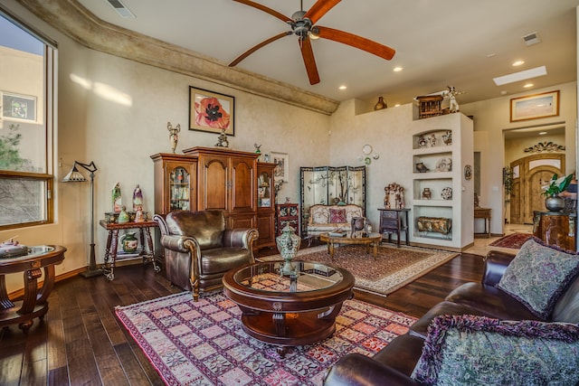 living room with dark hardwood / wood-style floors and ceiling fan