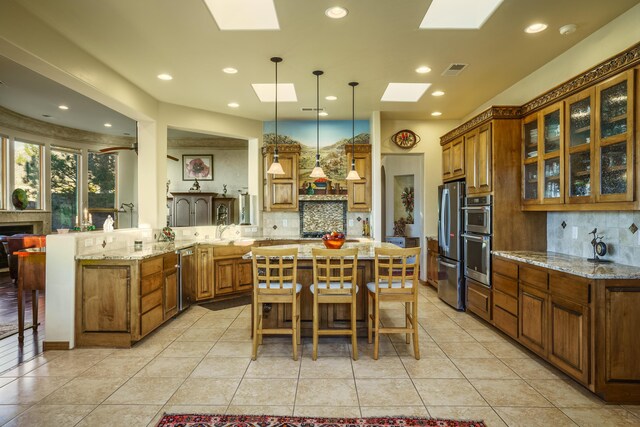 bedroom featuring light carpet, ceiling fan, and a tray ceiling