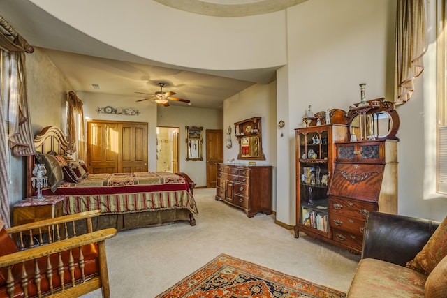 bedroom with light carpet and ceiling fan