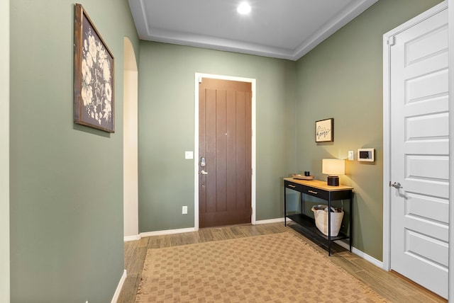 entryway with hardwood / wood-style flooring