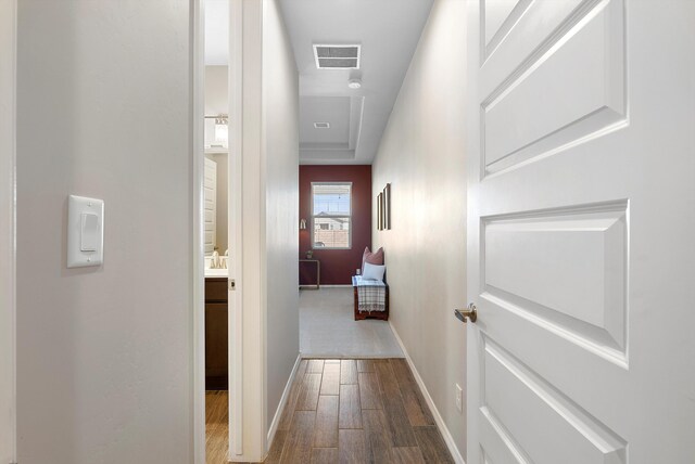 corridor with wood-type flooring