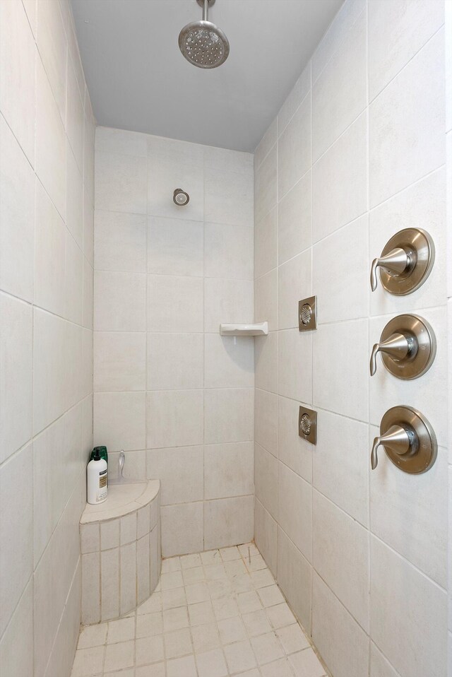 bathroom with a tile shower