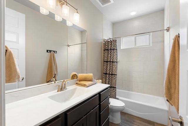 full bathroom featuring vanity, toilet, shower / tub combo, and wood-type flooring