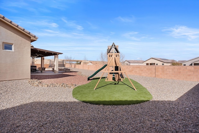 view of jungle gym featuring a patio area