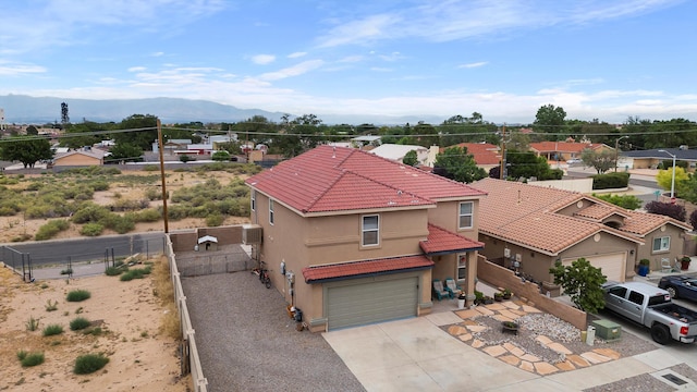 birds eye view of property featuring a mountain view