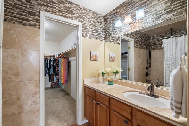 bathroom featuring shower / tub combo with curtain and vanity