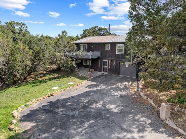 front of property featuring a garage and a front yard