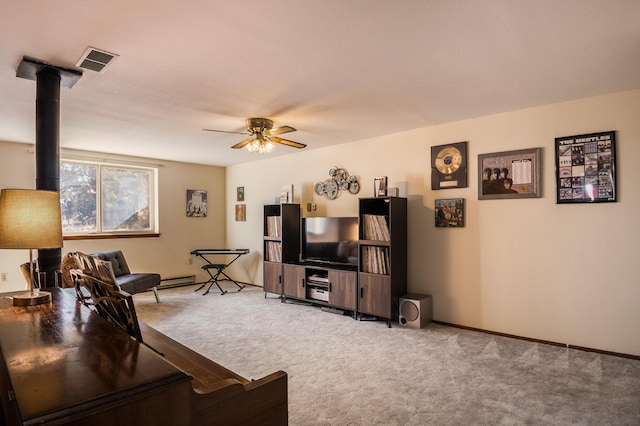 carpeted living room with ceiling fan