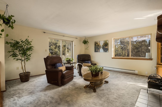 sitting room featuring a baseboard radiator and carpet