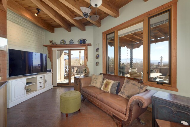 living room with ceiling fan, wooden ceiling, and beam ceiling