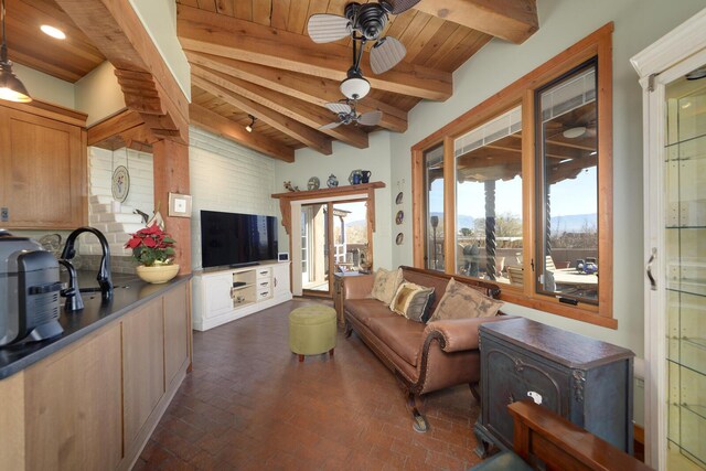 living room featuring ceiling fan, wood ceiling, and beam ceiling