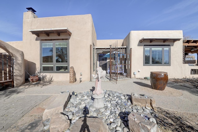 426 Ruffles Ln, Corrales, NM 87048 - back of house with stucco siding