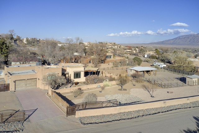 birds eye view of property with a mountain view