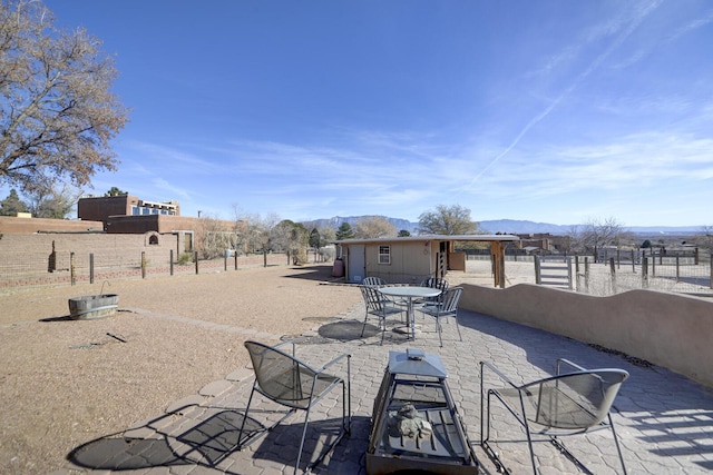 view of patio featuring a mountain view and a rural view