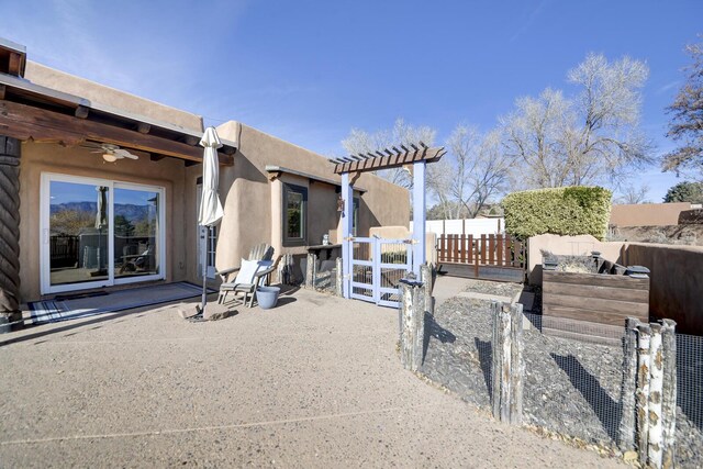 view of patio / terrace featuring ceiling fan