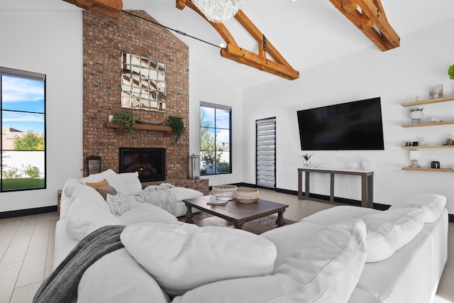 living room featuring beam ceiling, a fireplace, and high vaulted ceiling